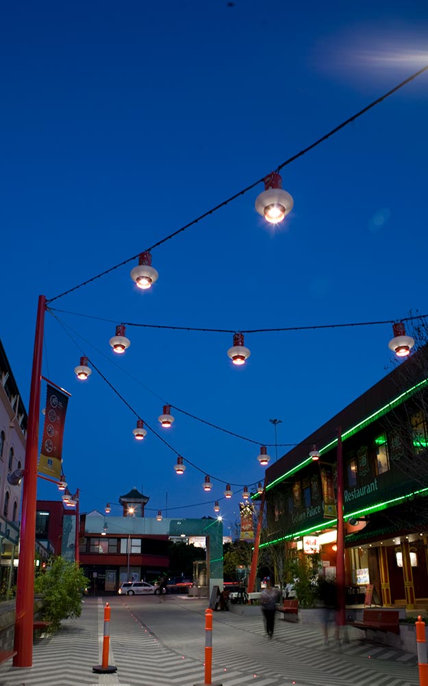 Brisbane Chinatown catenary lighting system with custom made light fittings